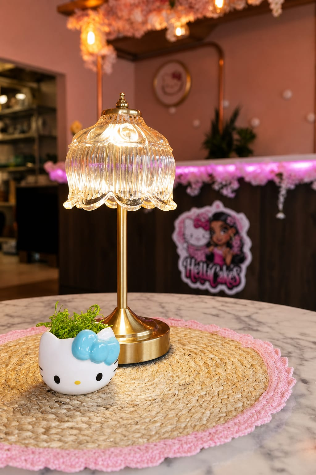 Hello Kitty lamp detail on a pink café table